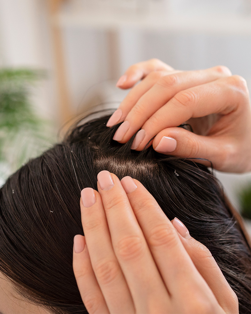 close-up-hands-treating-dandruff
